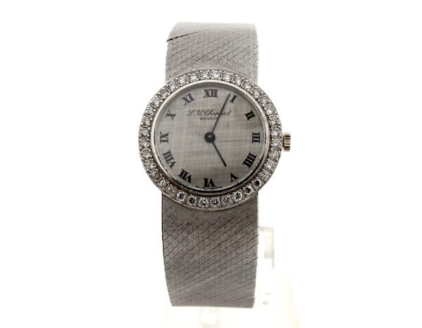 CHOPARD Damenuhr in 18 Karat Weißgold, Handaufzug und Diamanten-Lünette.