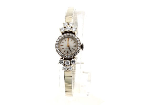 OMEGA Damenuhr in 18 Karat Gold, 10 Brillanten und Brillanten-Lünette TW-Vsi 1,5 Karat